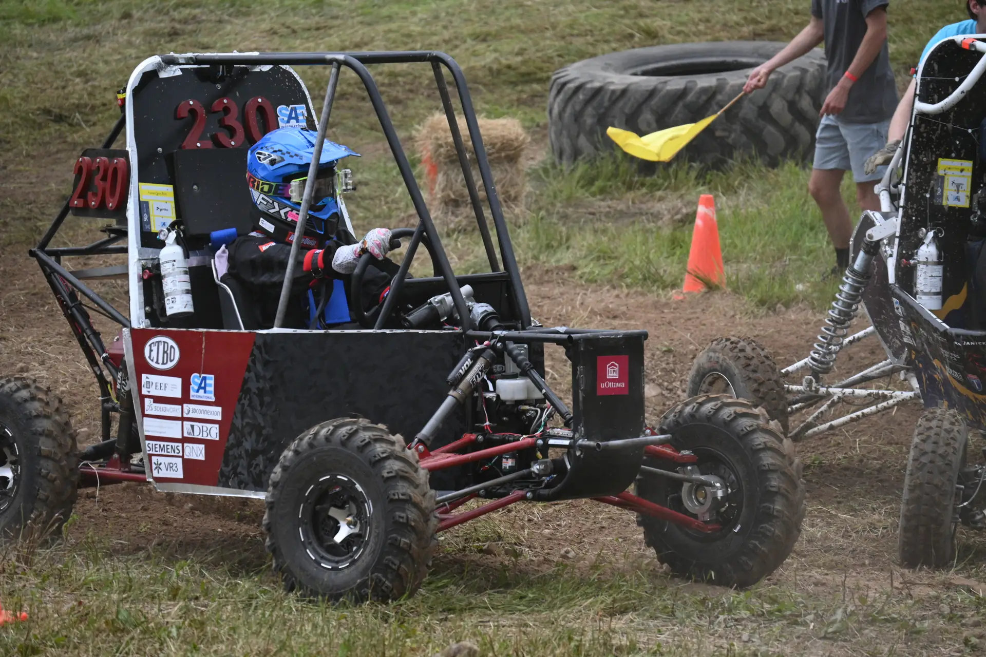 Car #230 with the driver at the wheel
