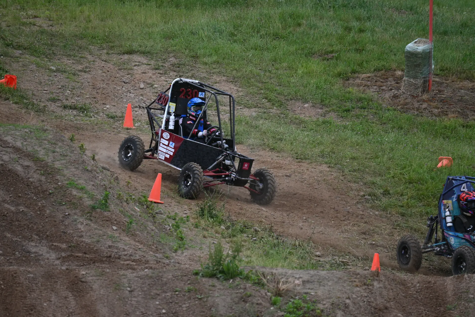 Car #230 on a rutted section of the course
