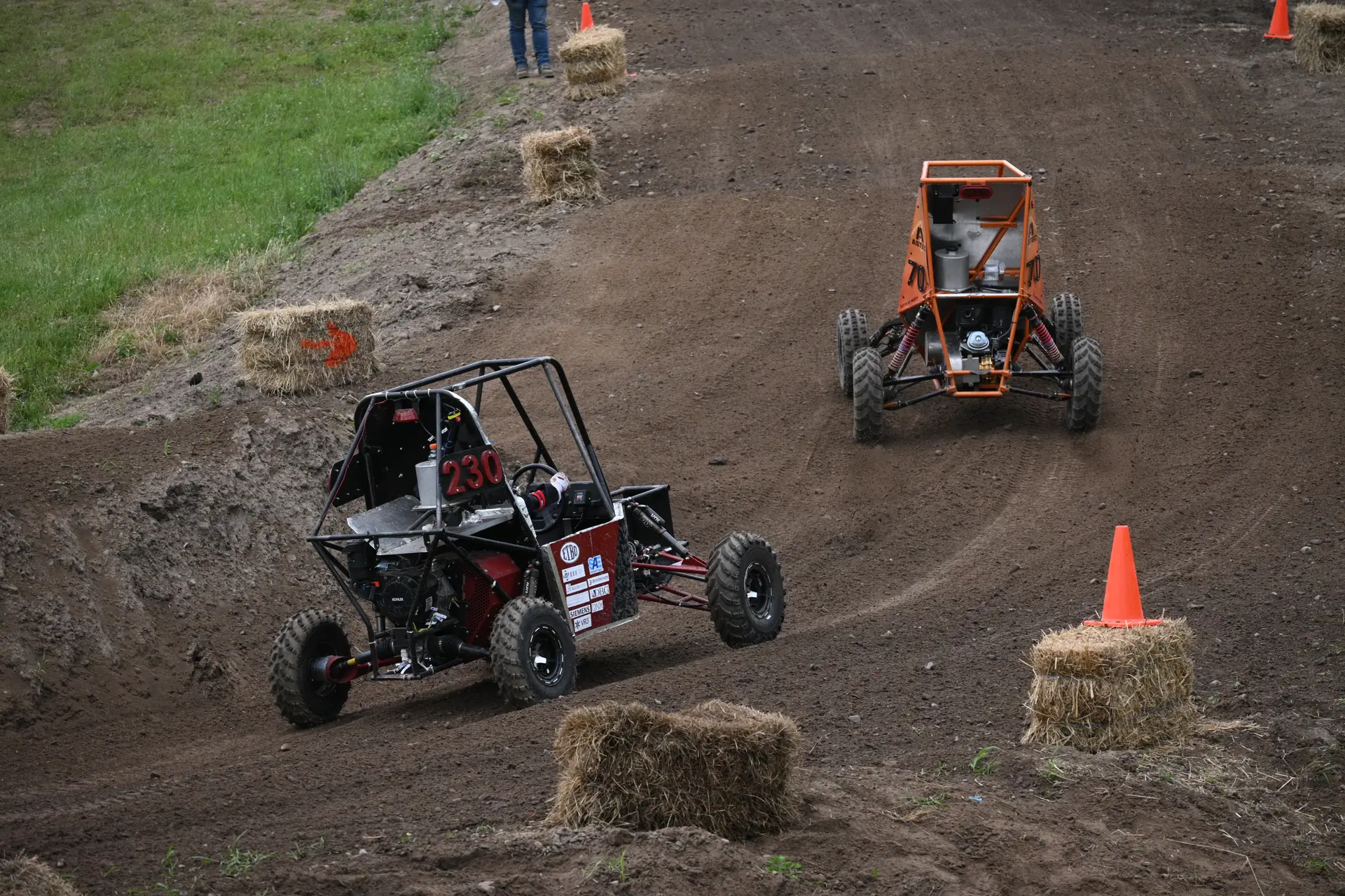 Car cornering beside another team's car