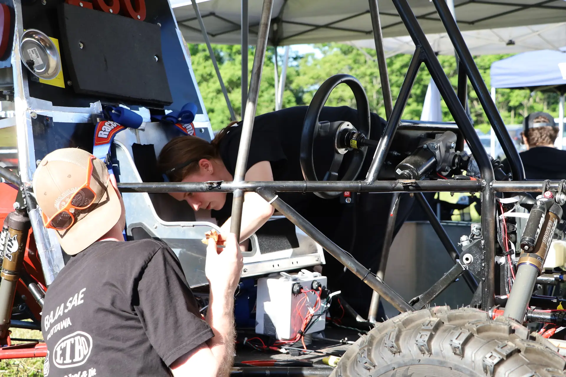 Team member inspecting the cockpit
