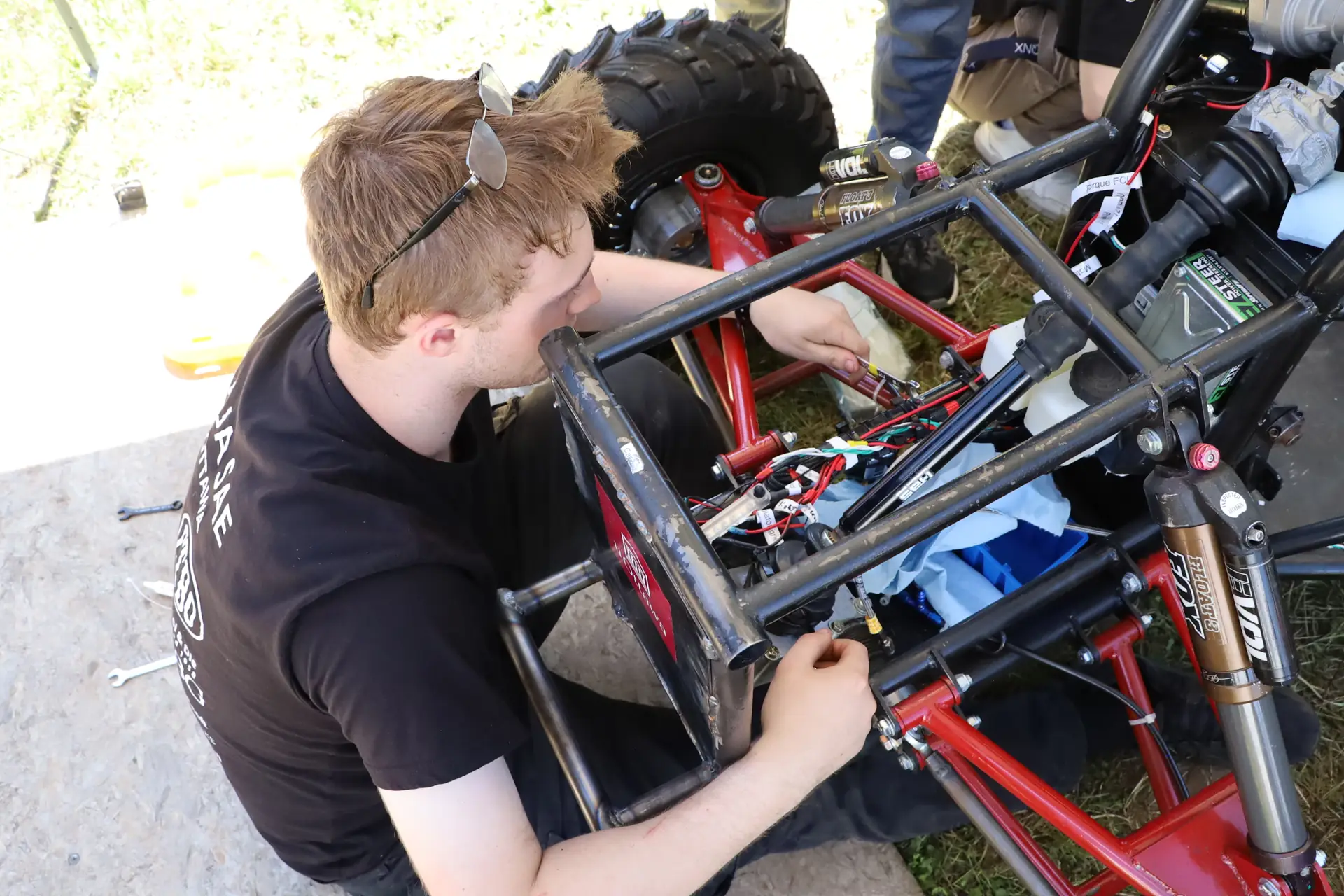 Team member working on the rear frame