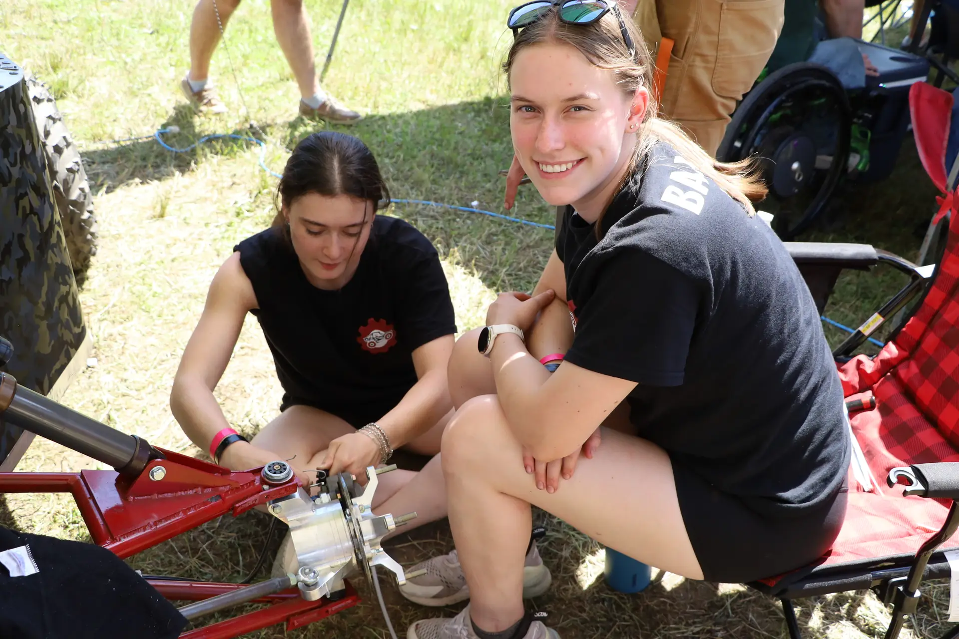 Two team members working on a suspension upright