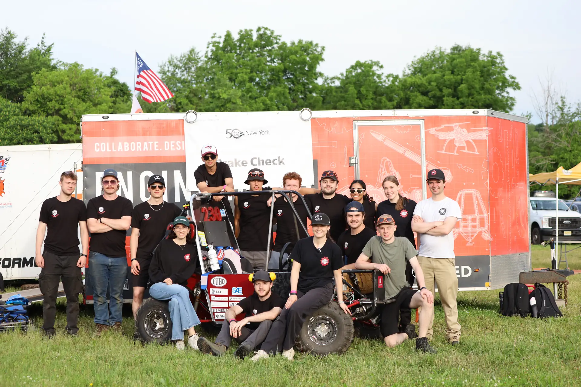 Rough Rider Racing team photo in front of the team trailer
