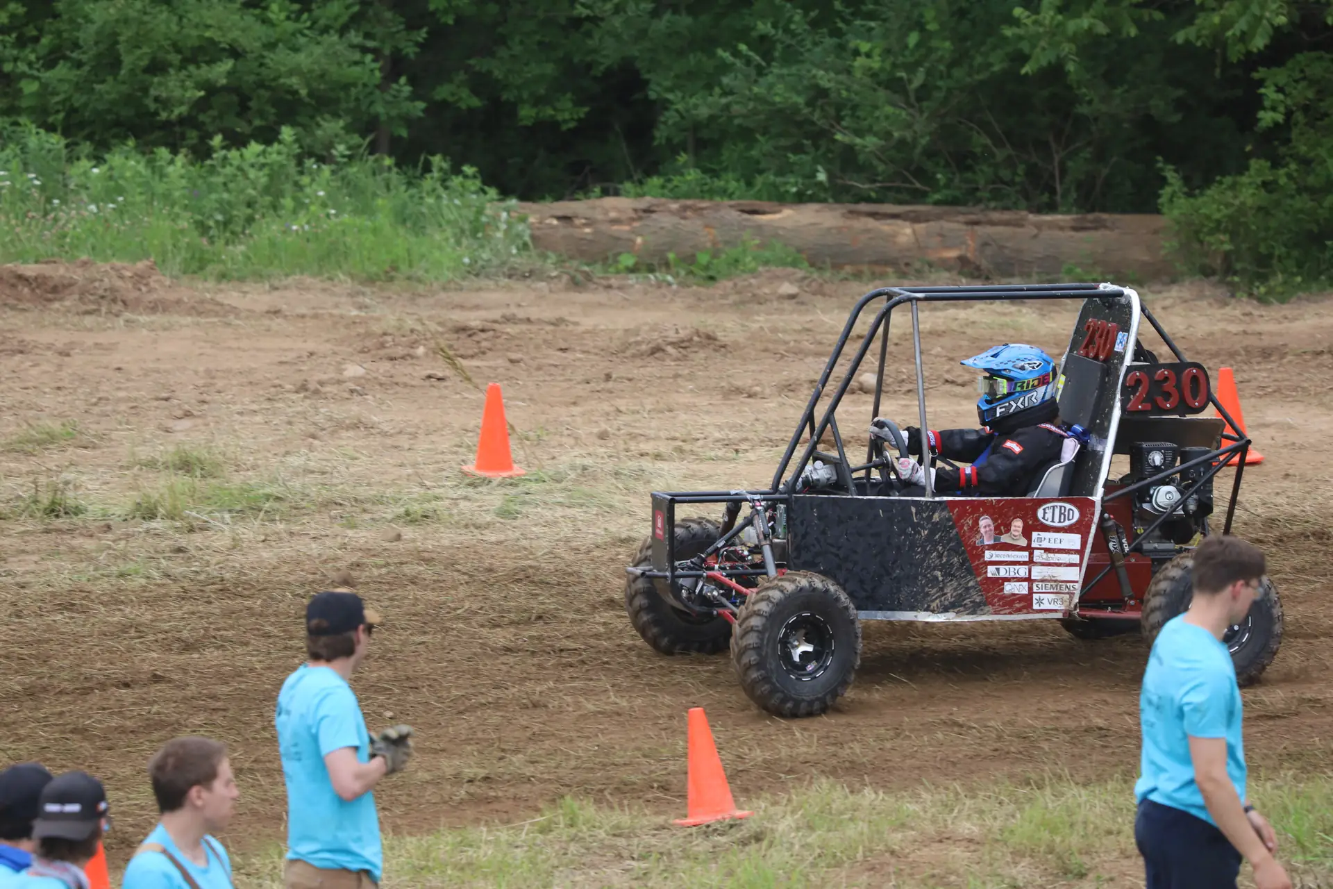 Car cornering near course marshals