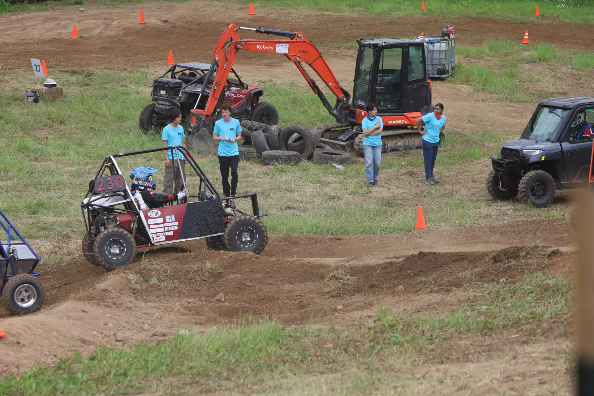 Car on course near an excavator